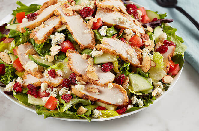 A Savannah chopped salad with grilled chicken, cranberries, almonds, and mixed greens.