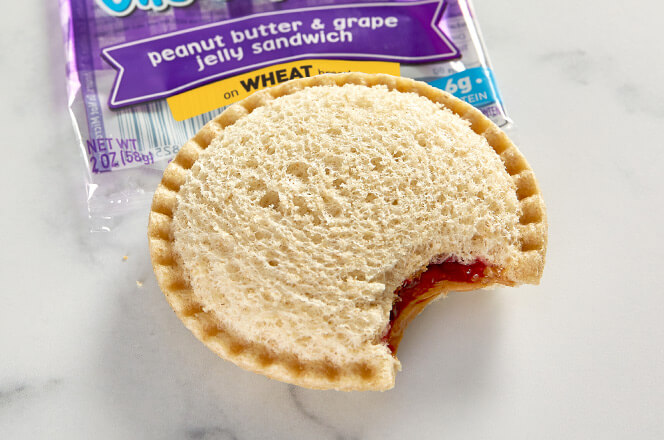 An uncrustables sandwich with a smooth, crust-free exterior.