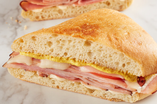 A Ham and Cheese Melt sandwich with ham, melted Swiss cheese, and Dijon mustard on toasted bread.