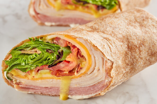 A McAlister’s turkey and ham Club Wrap, combining all the same ingredients as the sandwich version but wrapped in a soft tortilla.