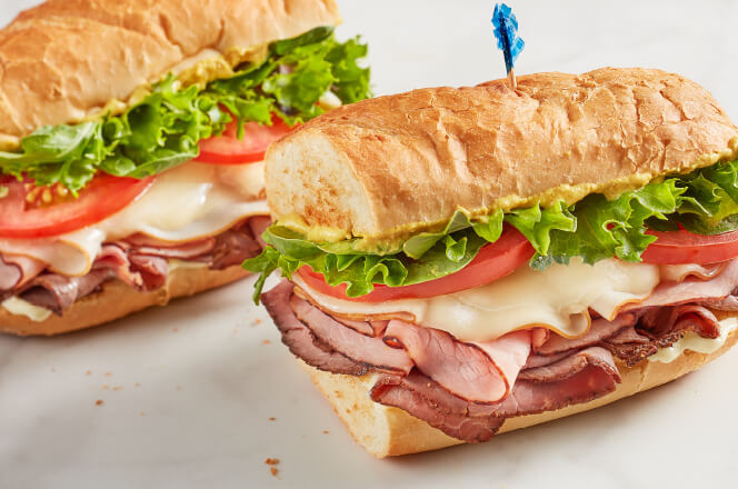 A 12-inch Memphian sandwich featuring turkey, ham, roast beef, provolone cheese, and fresh vegetables on toasted bread.