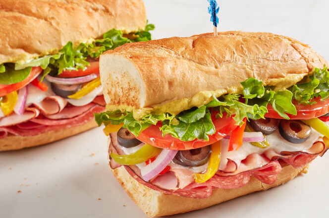 A 12-inch Italian sub sandwich with ham, salami, pepperoni, provolone cheese, fresh lettuce and tomato. 